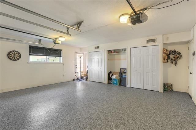 65 Monterrey Dr, Kenner, LA 70065 - garage featuring a garage door opener