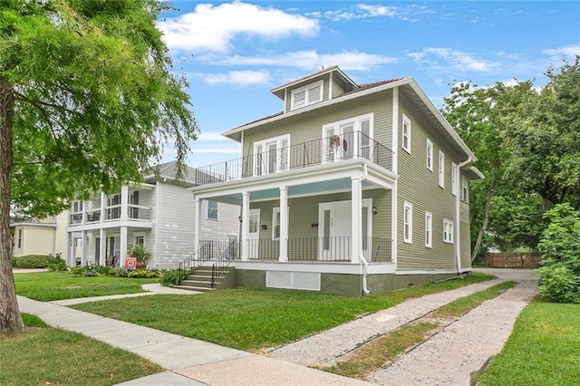 5655 Hawthorne Pl, New Orleans, LA 70124 - traditional style home featuring a balcony, a porch, a front yard, and driveway