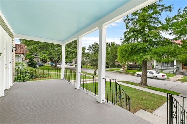 5655 Hawthorne Pl, New Orleans, LA 70124 - porch featuring a lawn