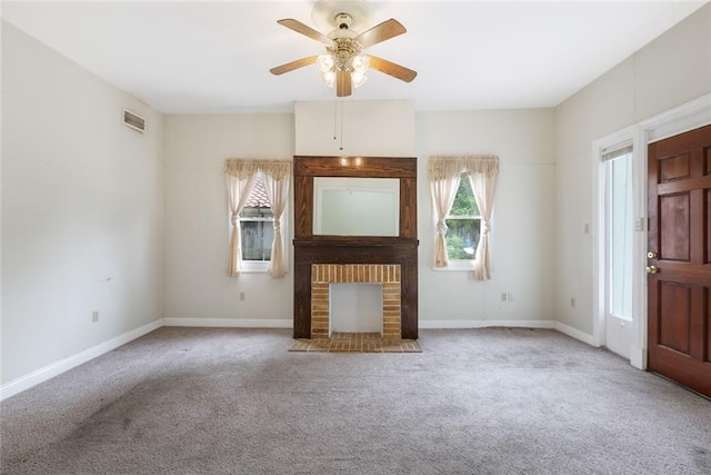 5655 Hawthorne Pl, New Orleans, LA 70124 - unfurnished living room featuring a ceiling fan, carpet, baseboards, and a brick fireplace