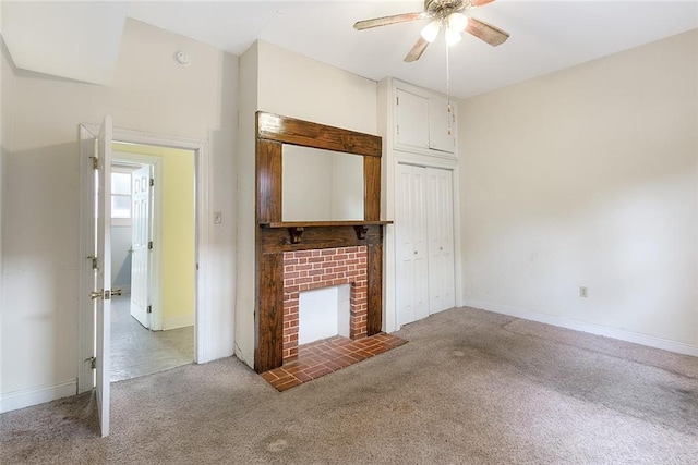 5655 Hawthorne Pl, New Orleans, LA 70124 - unfurnished living room with a ceiling fan, carpet floors, baseboards, and a brick fireplace