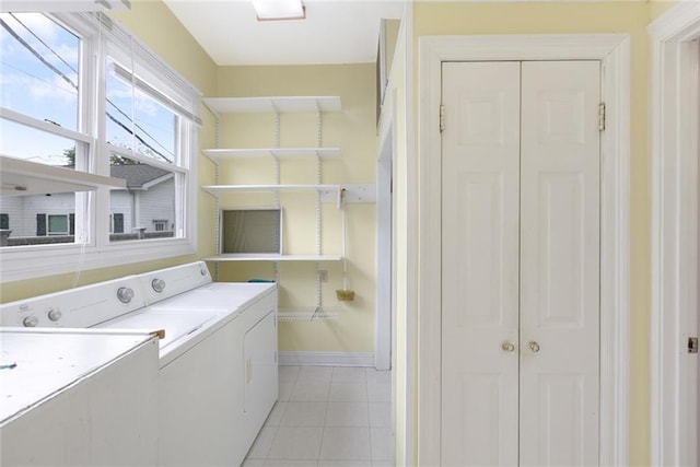 5655 Hawthorne Pl, New Orleans, LA 70124 - laundry area with washer and dryer, baseboards, and light tile patterned floors