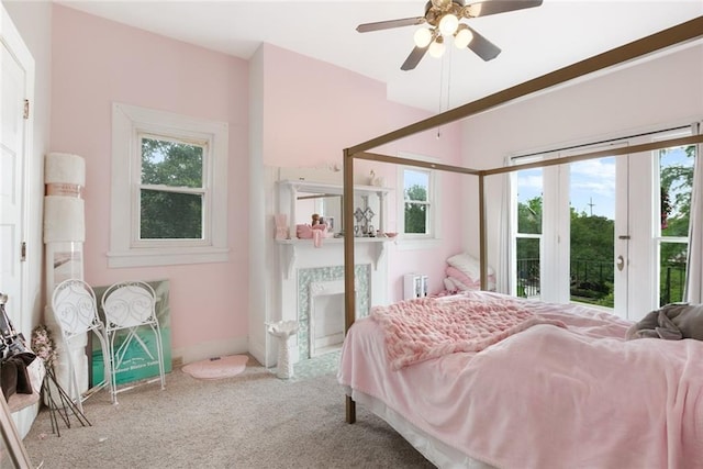5655 Hawthorne Pl, New Orleans, LA 70124 - bedroom featuring carpet floors, radiator heating unit, ceiling fan, baseboards, and access to outside
