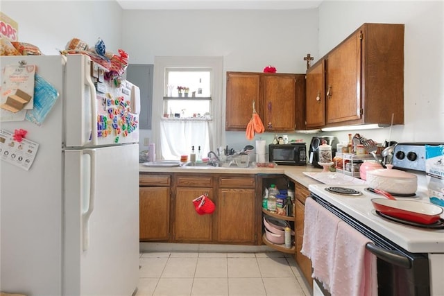 5655 Hawthorne Pl, New Orleans, LA 70124 - kitchen featuring white appliances, brown cabinetry, light countertops, and a sink