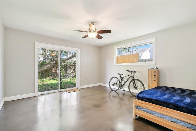 8621 Cohn St, New Orleans, LA 70118 - bedroom featuring concrete floors, access to exterior, and a ceiling fan