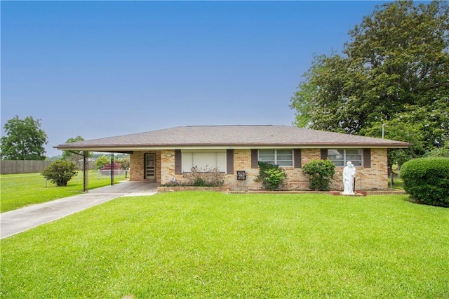 477 S Church St, Garyville, LA 70051 - view of front of house with concrete driveway, an attached carport, and brick siding