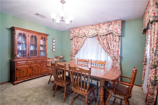 477 S Church St, Garyville, LA 70051 - dining room with a chandelier, light colored carpet, and baseboards