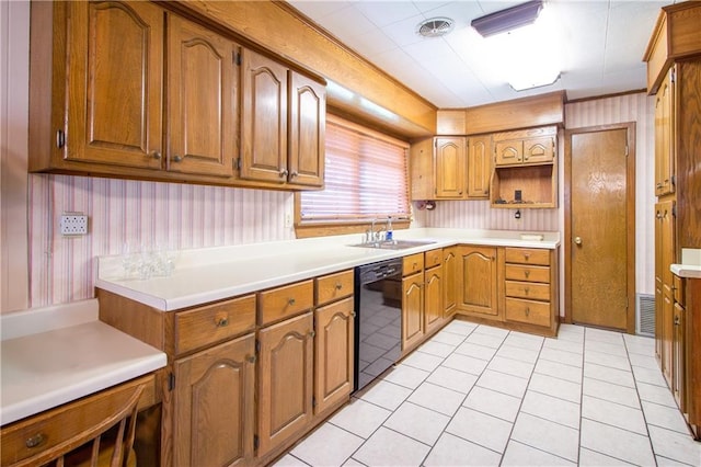 477 S Church St, Garyville, LA 70051 - kitchen featuring dishwasher, a sink, brown cabinets, light tile patterned floors, and light countertops