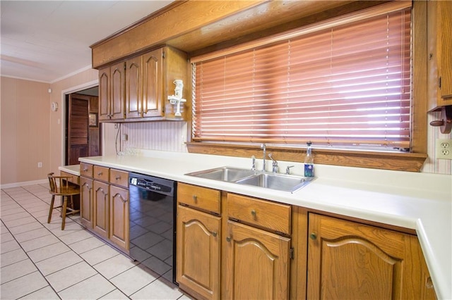 477 S Church St, Garyville, LA 70051 - kitchen with black dishwasher, a sink, light tile patterned floors, light countertops, and ornamental molding
