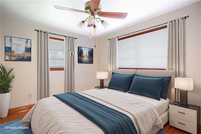 477 S Church St, Garyville, LA 70051 - bedroom featuring wood finished floors, baseboards, and ceiling fan