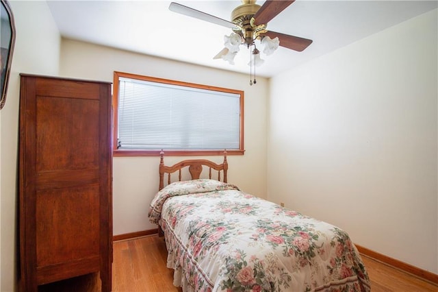 477 S Church St, Garyville, LA 70051 - bedroom featuring baseboards, light wood-style flooring, and ceiling fan