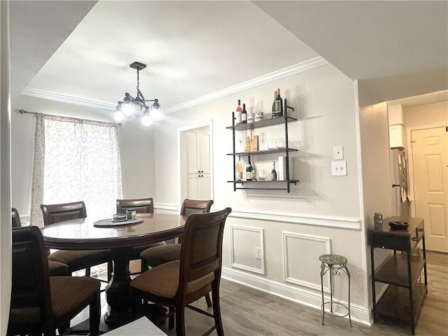 29 Brandon Hall Dr Unit D, Destrehan, LA 70047 - dining room featuring ornamental molding, wood finished floors, and a chandelier