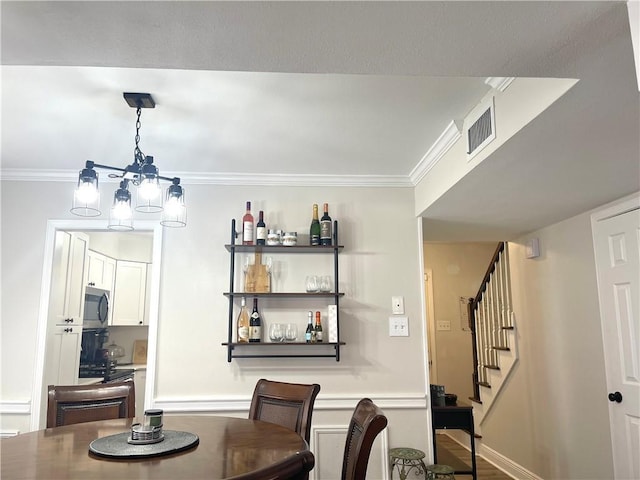 29 Brandon Hall Dr Unit D, Destrehan, LA 70047 - dining area featuring stairway and crown molding