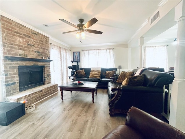 29 Brandon Hall Dr Unit D, Destrehan, LA 70047 - living room with a ceiling fan, wood finished floors, a fireplace, and ornamental molding