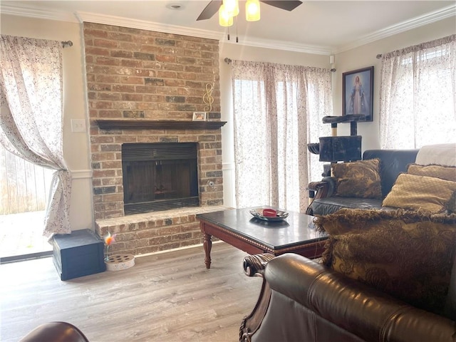 29 Brandon Hall Dr Unit D, Destrehan, LA 70047 - living area with a ceiling fan, crown molding, plenty of natural light, wood finished floors, and a fireplace