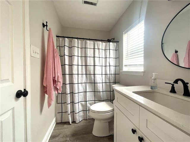 29 Brandon Hall Dr Unit D, Destrehan, LA 70047 - bathroom with wood finished floors, vanity, toilet, curtained shower, and baseboards