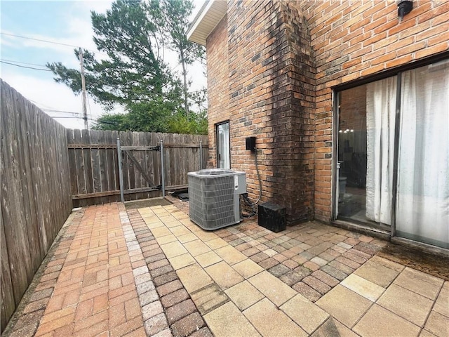 29 Brandon Hall Dr Unit D, Destrehan, LA 70047 - view of patio featuring central AC unit and a gate