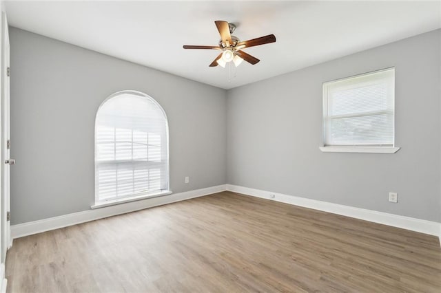 7500 Primrose Dr, New Orleans, LA 70126 - unfurnished room with ceiling fan, wood finished floors, and baseboards
