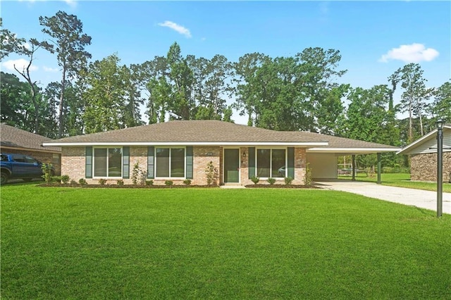 602 Susan Dr, Hammond, LA 70403 - ranch-style house featuring driveway, a front lawn, a carport, and brick siding