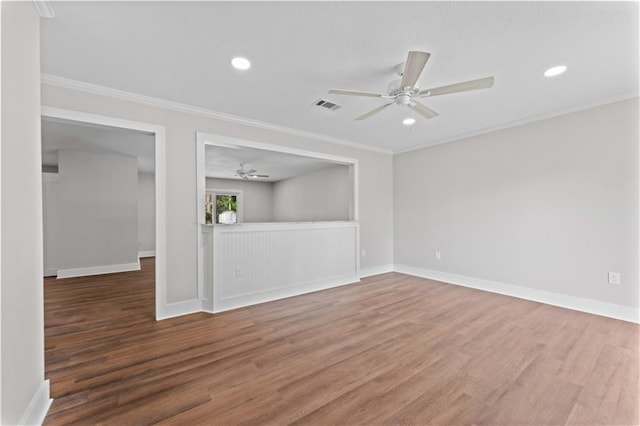 602 Susan Dr, Hammond, LA 70403 - empty room featuring a ceiling fan, wood finished floors, crown molding, baseboards, and recessed lighting