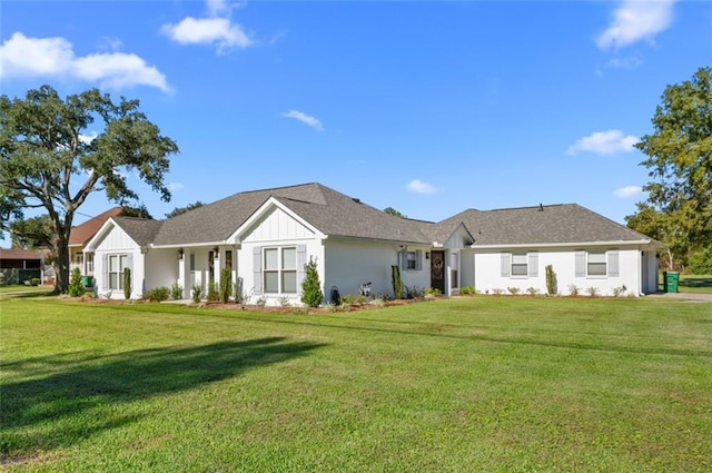 3508 Main St, La Place, LA 70068 - view of front of property with a front lawn and board and batten siding