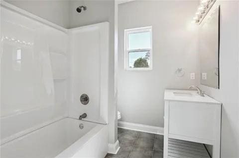 4021 N Rocheblave St, New Orleans, LA 70117 - full bath featuring vanity, baseboards, washtub / shower combination, and toilet