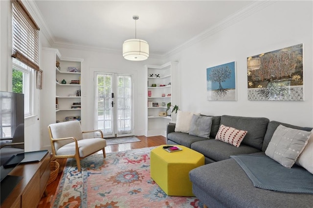 304 Henry Clay Ave, New Orleans, LA 70118 - living room featuring crown molding, healthy amount of natural light, and wood finished floors
