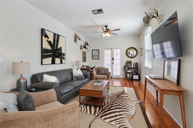 304 Henry Clay Ave, New Orleans, LA 70118 - living room featuring french doors, a ceiling fan, and wood finished floors