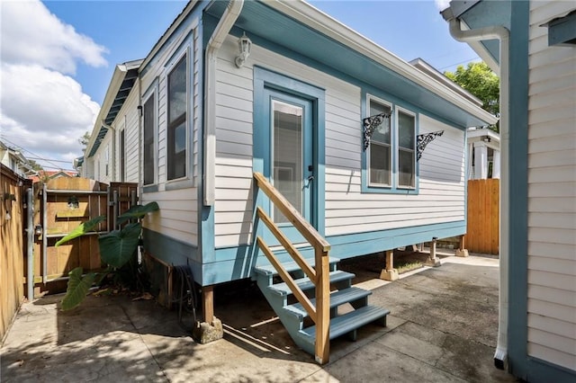304 Henry Clay Ave, New Orleans, LA 70118 - rear view of property featuring entry steps and a patio area