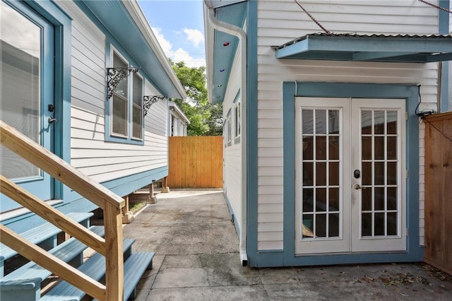 304 Henry Clay Ave, New Orleans, LA 70118 - view of property exterior with french doors and a patio area