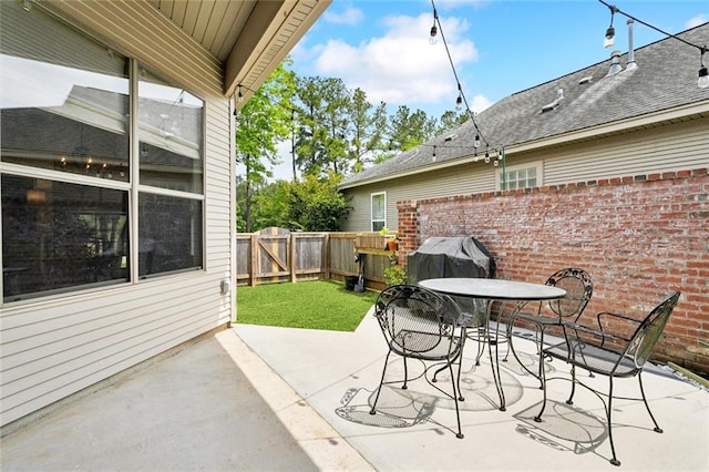 228 Shady Pond Ln, Covington, LA 70435 - fenced backyard with a patio, outdoor dining space, and a grill