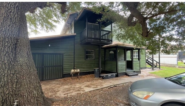 5022 Mcmurtry St, Marrero, LA 70072 - rear view of property with entry steps and a balcony