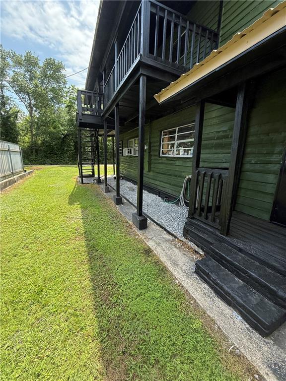 5022 Mcmurtry St, Marrero, LA 70072 - view of grassy yard featuring a wooden deck
