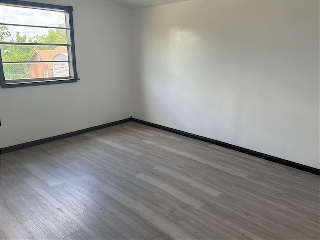 5022 Mcmurtry St, Marrero, LA 70072 - empty room featuring wood finished floors and baseboards