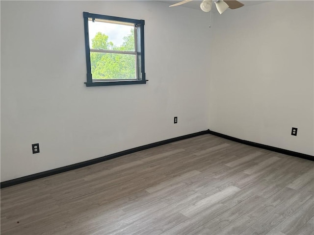 5022 Mcmurtry St, Marrero, LA 70072 - empty room with light wood-style floors, ceiling fan, and baseboards
