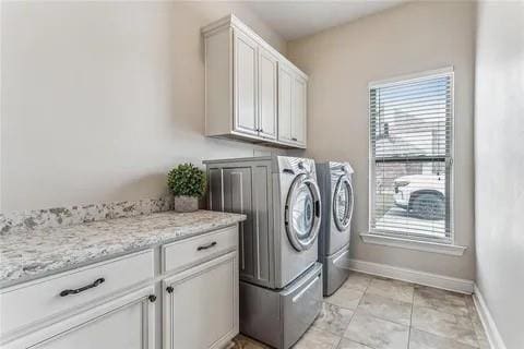 298 Saw Grass Loop, Covington, LA 70435 - washroom featuring washer and clothes dryer, cabinet space, and baseboards