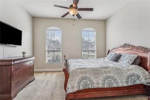 298 Saw Grass Loop, Covington, LA 70435 - carpeted bedroom featuring baseboards and ceiling fan