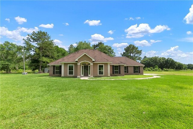 15488 Lake Ramsey Rd, Covington, LA 70435 - ranch-style house featuring a front lawn