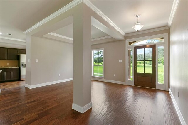 15488 Lake Ramsey Rd, Covington, LA 70435 - entrance foyer with dark wood-style flooring, baseboards, ornamental molding, and decorative columns