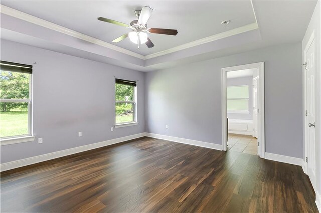 15488 Lake Ramsey Rd, Covington, LA 70435 - unfurnished room with dark wood-style floors, baseboards, a ceiling fan, ornamental molding, and a tray ceiling