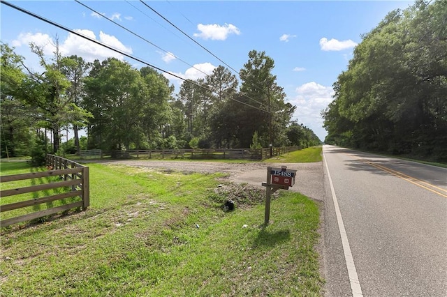 15488 Lake Ramsey Rd, Covington, LA 70435 - view of asphalt road with a rural view