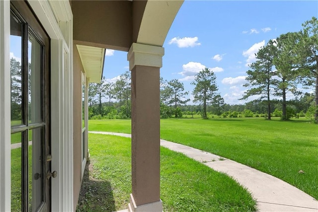 15488 Lake Ramsey Rd, Covington, LA 70435 - view of green lawn with view of wooded area