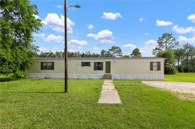 15488 Lake Ramsey Rd, Covington, LA 70435 - manufactured / mobile home featuring entry steps and a front lawn