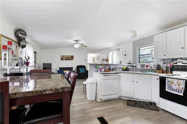 15488 Lake Ramsey Rd, Covington, LA 70435 - kitchen featuring white appliances, a peninsula, a sink, light wood finished floors, and white cabinets