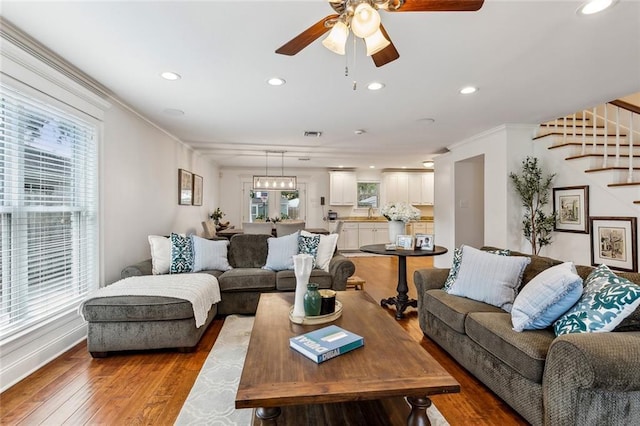 920 Bonnabel Blvd, Metairie, LA 70005 - living room featuring stairs, ceiling fan, wood-type flooring, recessed lighting, and plenty of natural light