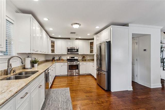 920 Bonnabel Blvd, Metairie, LA 70005 - kitchen with appliances with stainless steel finishes, a sink, white cabinets, and recessed lighting