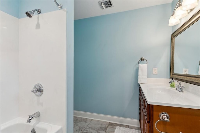 920 Bonnabel Blvd, Metairie, LA 70005 - full bathroom featuring vanity,  shower combination, baseboards, and marble look tile flooring