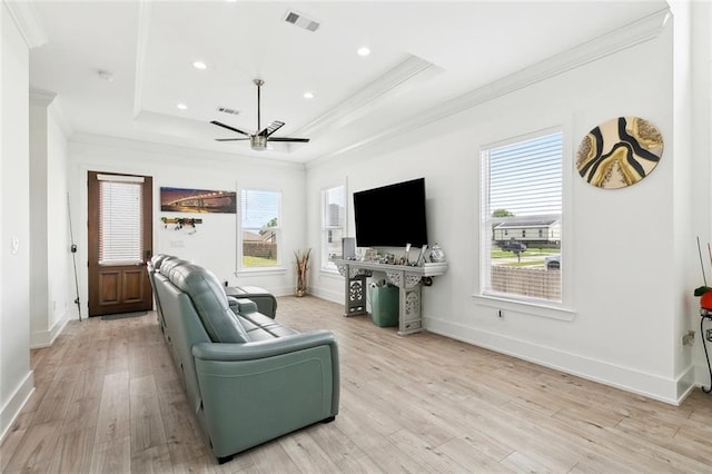67 W Claiborne Sq, Chalmette, LA 70043 - living area with ornamental molding, ceiling fan, a tray ceiling, light wood-style flooring, and recessed lighting