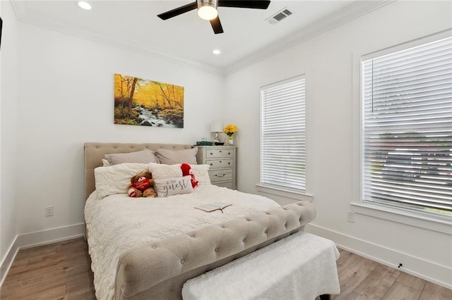 67 W Claiborne Sq, Chalmette, LA 70043 - bedroom featuring baseboards, light wood-style flooring, crown molding, recessed lighting, and a ceiling fan