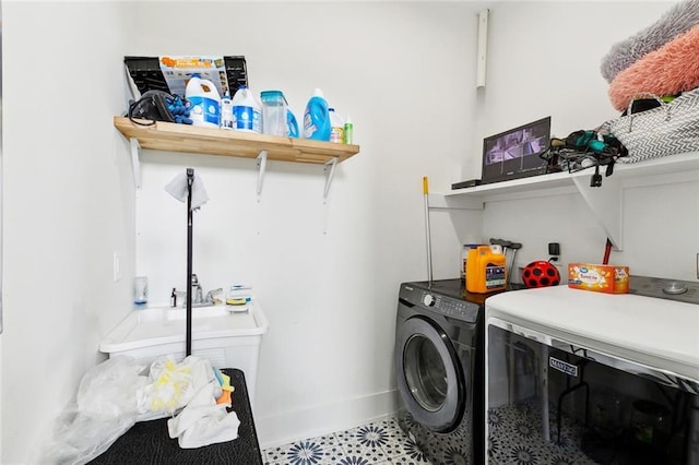 67 W Claiborne Sq, Chalmette, LA 70043 - washroom featuring washing machine and dryer, baseboards, and tile patterned floors
